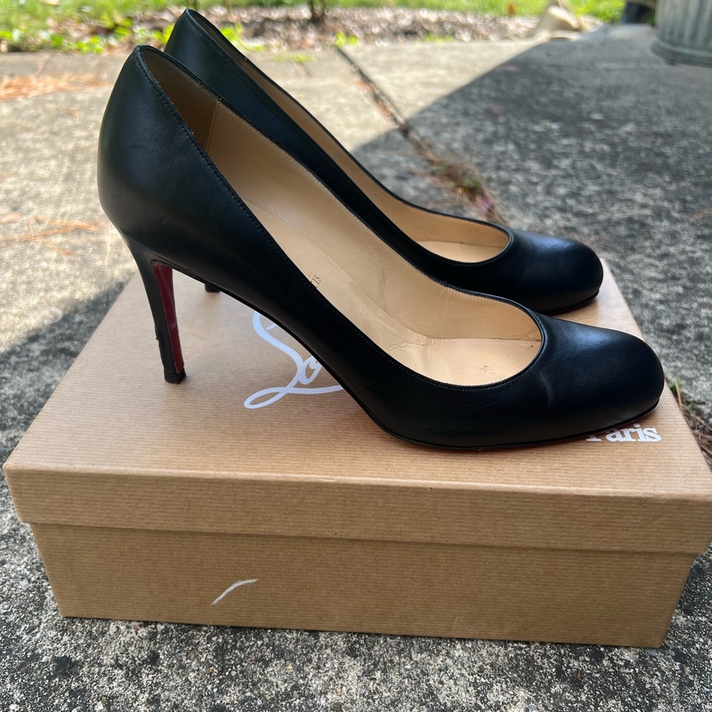 Gently used Cristian Louboutin black leather heels/pumps. Round/almond toe.